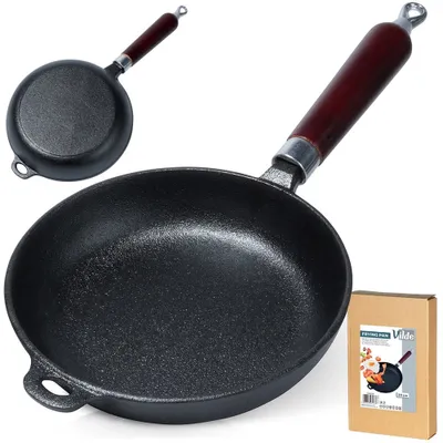 A cast iron frying pan with a wooden handle is shown, along with its packaging.
