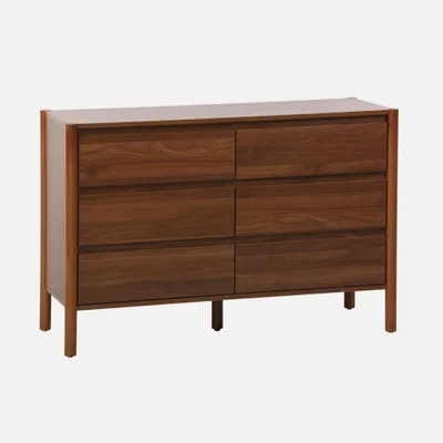 A wooden dresser with six drawers against a white background.
