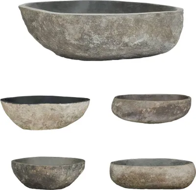 A collage of five stone-like basins against a white background.