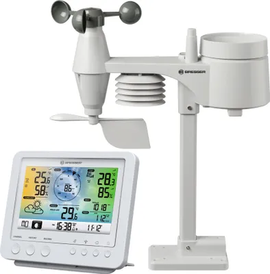 A white weather station with a display console and a multi-sensor outdoor unit.