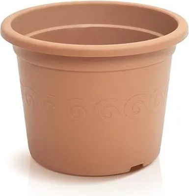 A terracotta-colored plastic plant pot with a decorative wavy pattern around the rim.