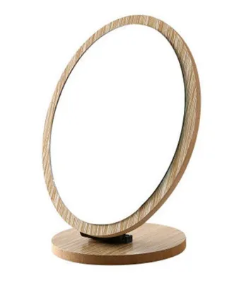 A wooden standing cosmetic mirror on a white background.