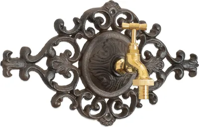 A decorative cast iron garden faucet with a brass tap, mounted on a white background.