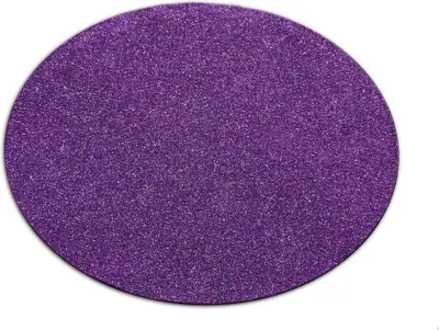 A round, purple, glittery tree skirt on a white background.