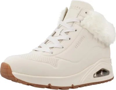 A single beige Skechers Uno sneaker with white laces and faux fur trim is shown against a white background.