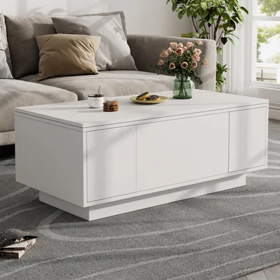Zdjęcie produktu dla Stolik kawowy o wymiarach 100 x 50 x 43 cm, wykonany z płyty wiórowej, w białym kolorze, wyposażony w podwójny mechanizm podnoszenia, ukrytą przestrzeń do przechowywania oraz 2 drzwiczki