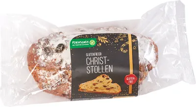 A packaged gluten-free Christmas stollen with raisins and almonds.
