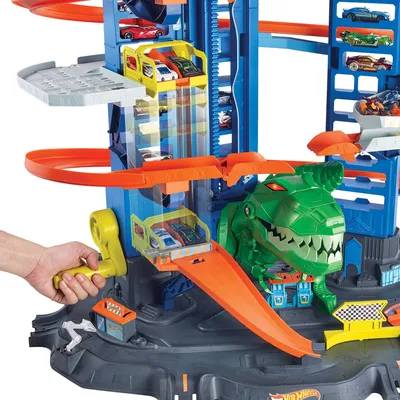 Produktbild von Hot Wheels Megacity Parkgarage T-Rex Angriff, Platz für über 100 Spielzeugautos