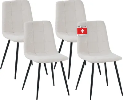 Four beige dining chairs are arranged in a studio setting against a white background.
