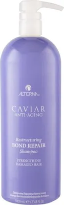 A bottle of Alterna Caviar Anti-Aging Restructuring Bond Repair Shampoo.