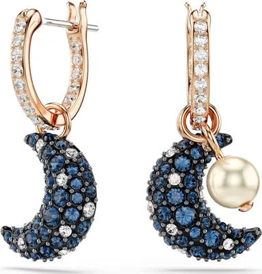 A pair of earrings with moon and pearl charms.