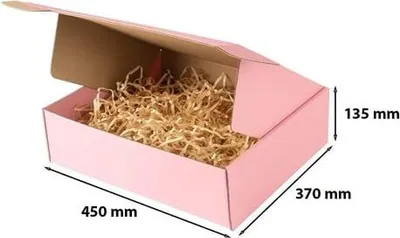 A pink cardboard box filled with shredded paper.