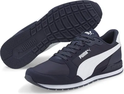 A pair of navy blue Puma running shoes with white accents, shown from a slightly elevated side angle with one shoe placed on top of the other to reveal the sole.