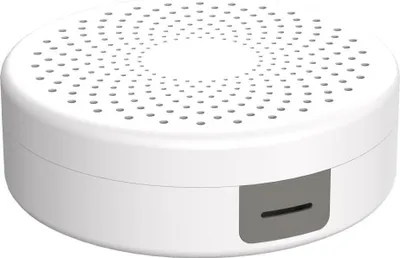 A white, round cable box with a perforated top and a gray slot on the side, shown against a white background.