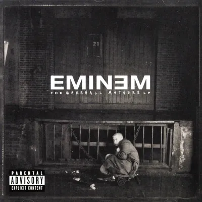 Eminem's 'The Marshall Mathers LP' album cover art, featuring the artist crouching in an alleyway with a parental advisory sticker.