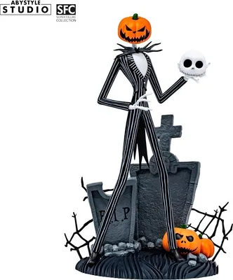 A figurine of Jack Skellington from The Nightmare Before Christmas, standing on a graveyard-themed base with pumpkins and tombstones.