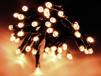 A close-up of a string of warm white LED lights.