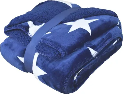 A folded blue blanket with white stars, held together by a blue strap.