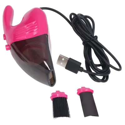 A pink and transparent mini USB vacuum cleaner with its accessories and USB cable, displayed on a white background.