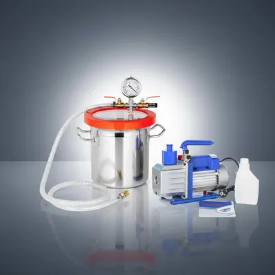 A vacuum pump system with a pressure chamber, a vacuum pump, and a bottle, arranged on a reflective surface against a gradient background.