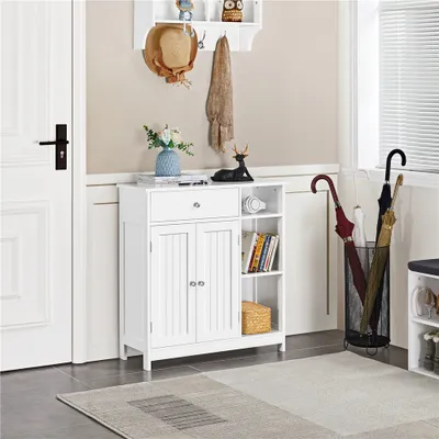 A white cabinet with doors and shelves in a hallway or entryway, next to a door and a window with blinds. There are decorative items on top of the cabinet and umbrellas in a stand.