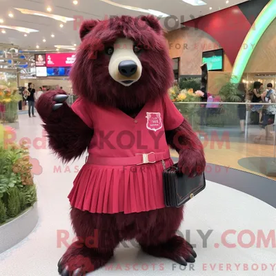 Obrázok produktu pre Maskot spoločnosti REDBROKOLY je kaštancová lenivka oblečená v minišortkách a s kabelkou