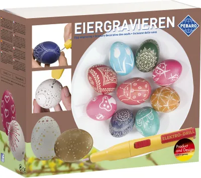 Product packaging for an egg engraving kit, showing decorated eggs and the engraving tool.