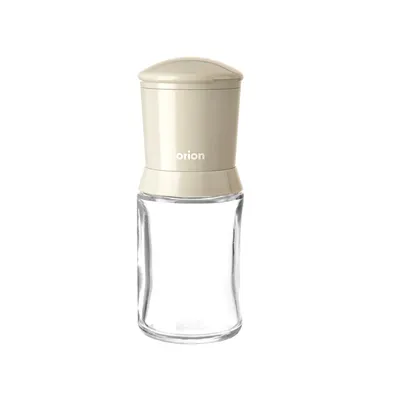 A clear studio shot of a spice grinder.