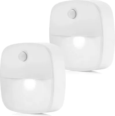 Two white LED night lights with motion and dusk sensors are shown against a white background.
