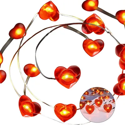 A string of red heart-shaped lights on a white background.
