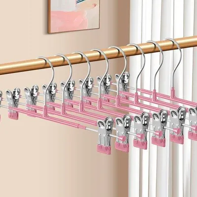 Immagine prodotto di 20 grucce regolabili con bottoni per pantaloni, gonne e pantaloncini - Salvaspazio - 30 cm - Rosa