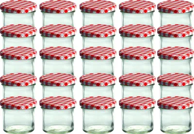 A grid of small glass jars with red and white checkered lids.