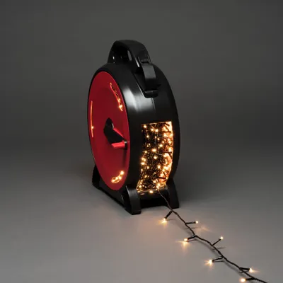 Produktbild von Konstsmide Micro LED Lichterkette mit Kabelaufroller, 1000 warm weiße Dioden, 30V, Außen (IP44), schwarzes Soft-Kabel - 3839-107