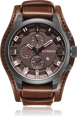 A close-up studio shot of a men's wristwatch with a brown leather strap and a brown dial.