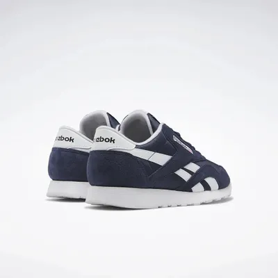 A pair of navy blue Reebok Classic Nylon 6390 men's sports shoes with white accents, shown from a rear-diagonal angle against a white background.