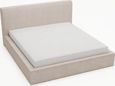 A beige upholstered bed frame with a mattress.