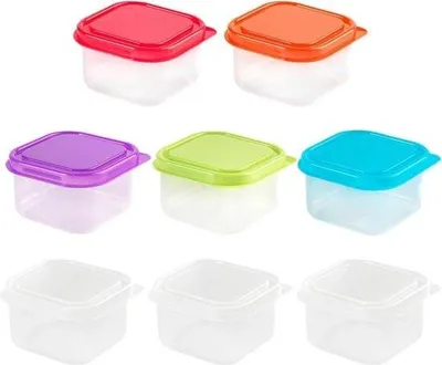 A collection of small, square, clear plastic food containers with colorful lids.