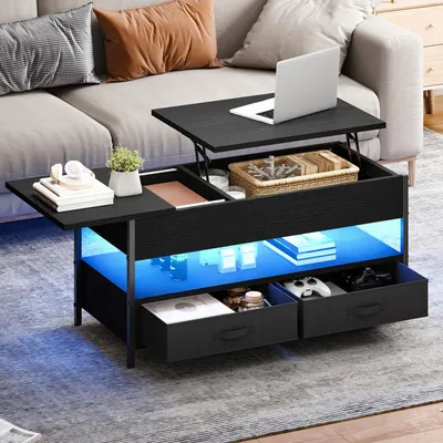 A modern black coffee table with a lift-top mechanism, storage compartments, and LED lighting, placed in a living room setting next to a sofa.