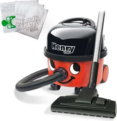 A Numatic Henry Hoover vacuum cleaner with a hose and floor attachment, along with three replacement HEPA-FLO bags.
