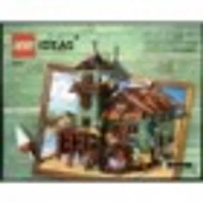 The image shows the packaging of a LEGO® Ideas set, featuring a model of an old fishing store.