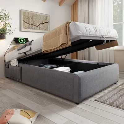 A bed with storage is shown in a bedroom setting with a wall art and a window in the background.