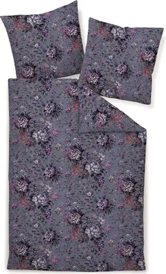 A flat lay of a floral patterned duvet cover and two pillowcases on a white background.