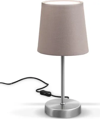 A close-up studio shot of a table lamp.