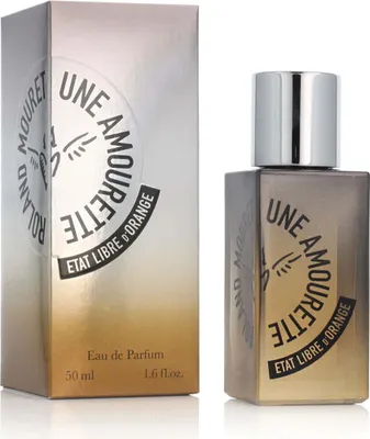 A perfume bottle and its box are displayed side-by-side against a white background.