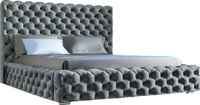 A tufted upholstered bed frame with two pillows on a white background.