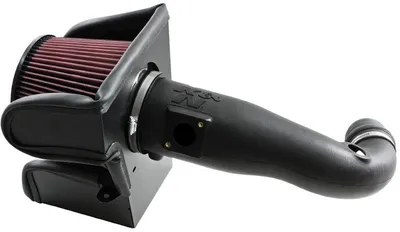 A black K&N air intake system with a red air filter is shown against a white background.