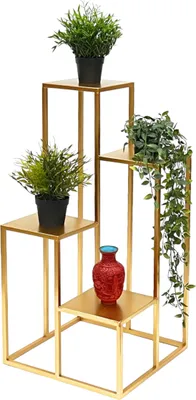 A multi-tiered gold plant stand with several potted plants and a red vase.