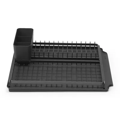 A dark grey dish drying rack with a utensil holder, shown from a slightly elevated side angle against a white background.