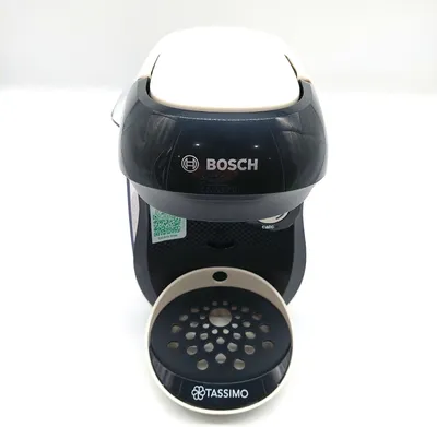 Produktbild von Bosch Tassimo Happy TAS107E, Pad-Kaffeemaschine, 0,7 l, Kaffeekapsel, 1400 W, Beige, Schwarz