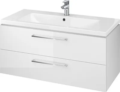 A white bathroom vanity with a sink and faucet.